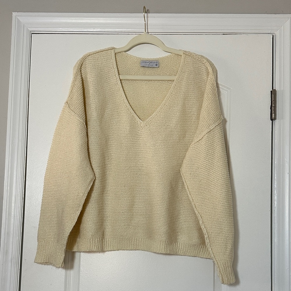 Pink Lily Soft Cream V-Neck Sweater. Slightly oversized/boxy fit.